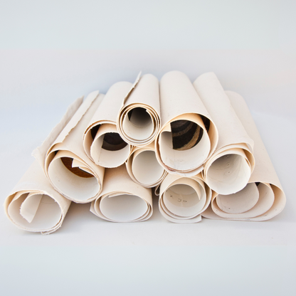 Stack of beige paper rolls on a white background