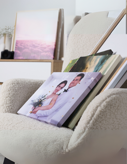 Albums on a chair with a focus on a wedding-themed photo