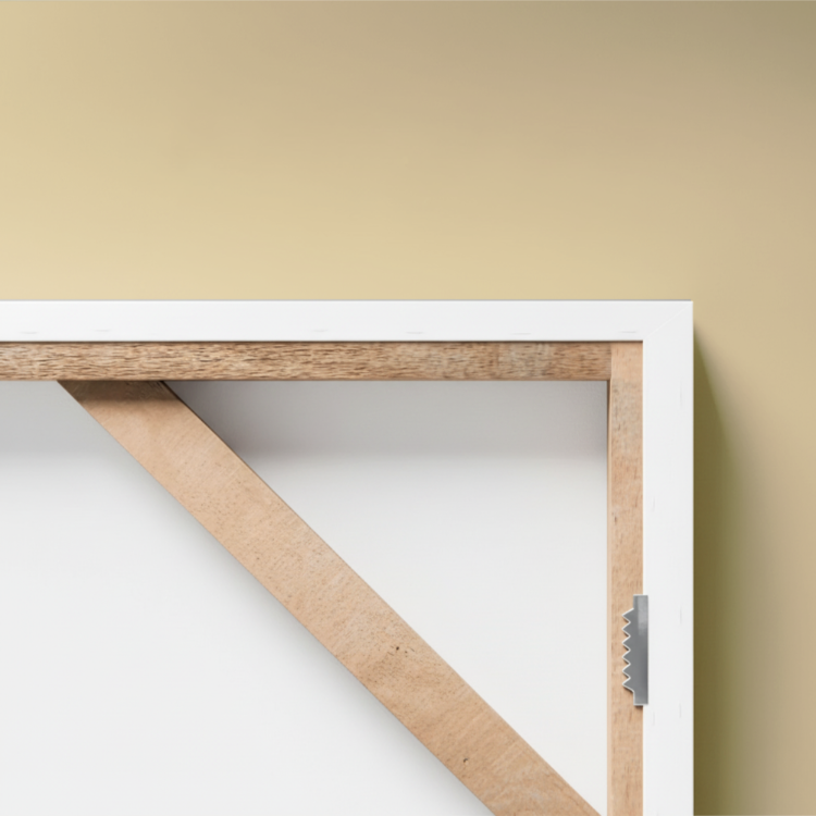 Wooden frame with white border on a beige wall